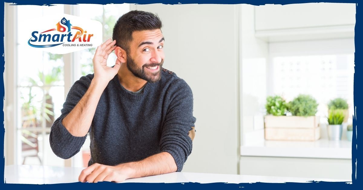 man hearing loud noises